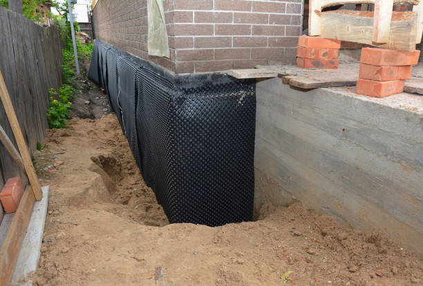 Happy homeowners after waterproofing job in Oak Ridge